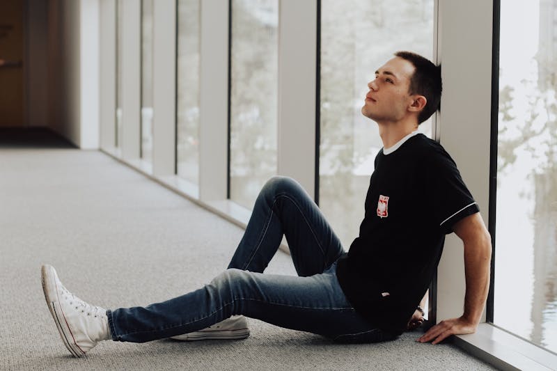 A guy thinking in his apartment.