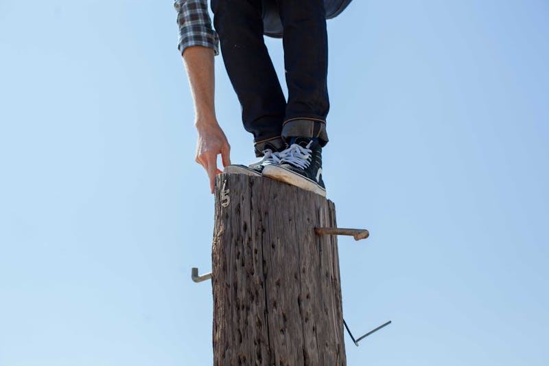 A man balancing on a log