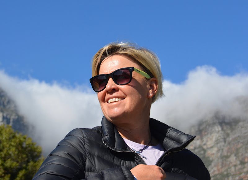 Anita with sunglasses. Table mountain in the background.