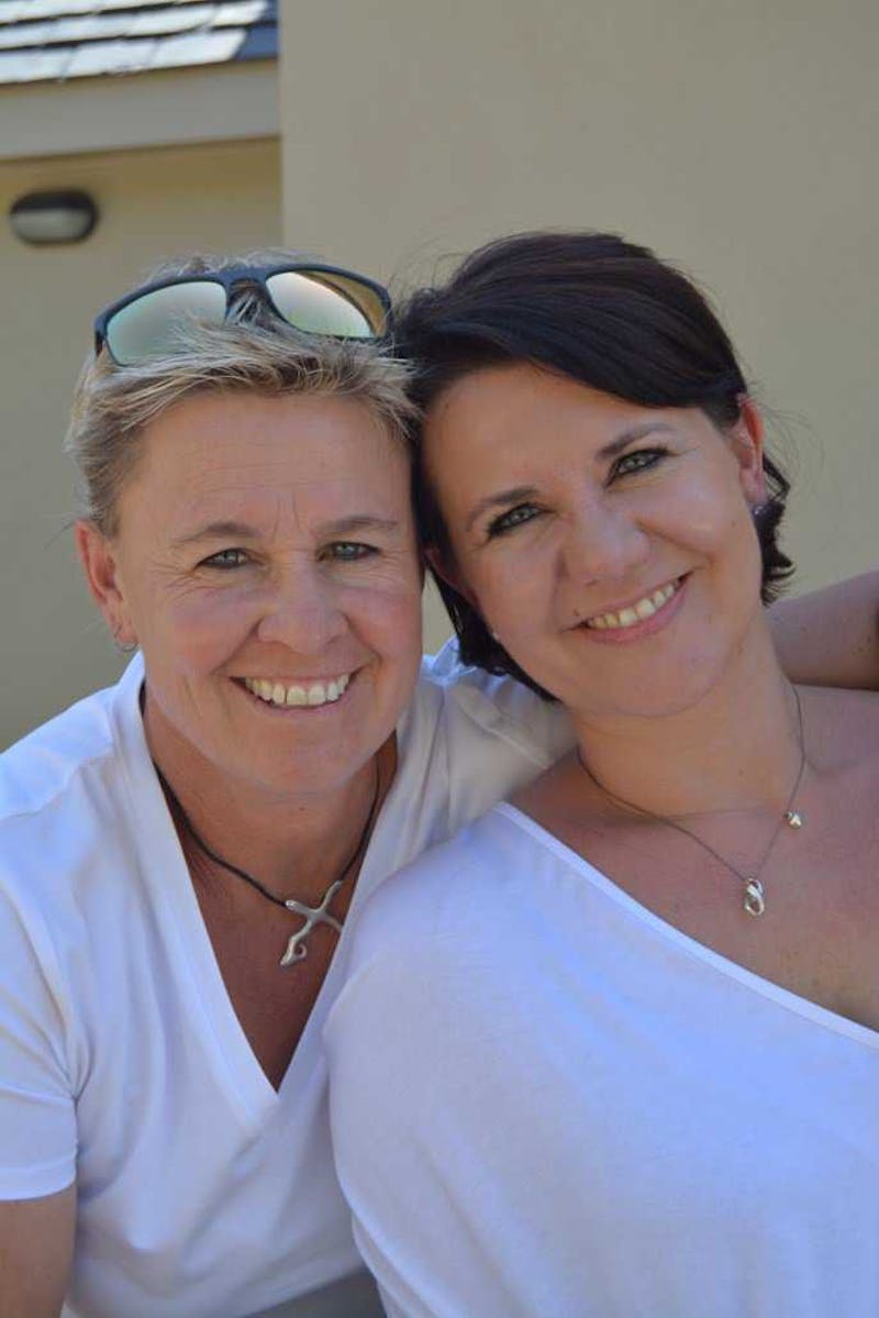 Brigette and Anita in white shirts.