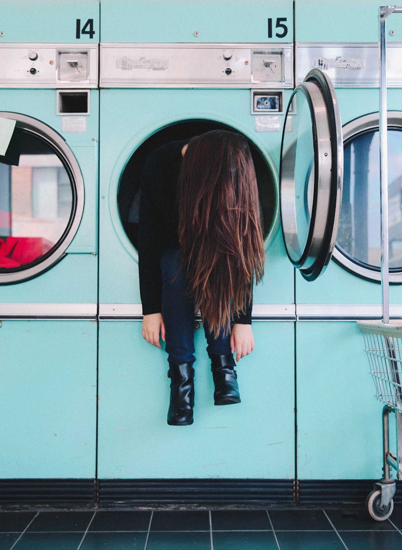 Girl in washing machine.