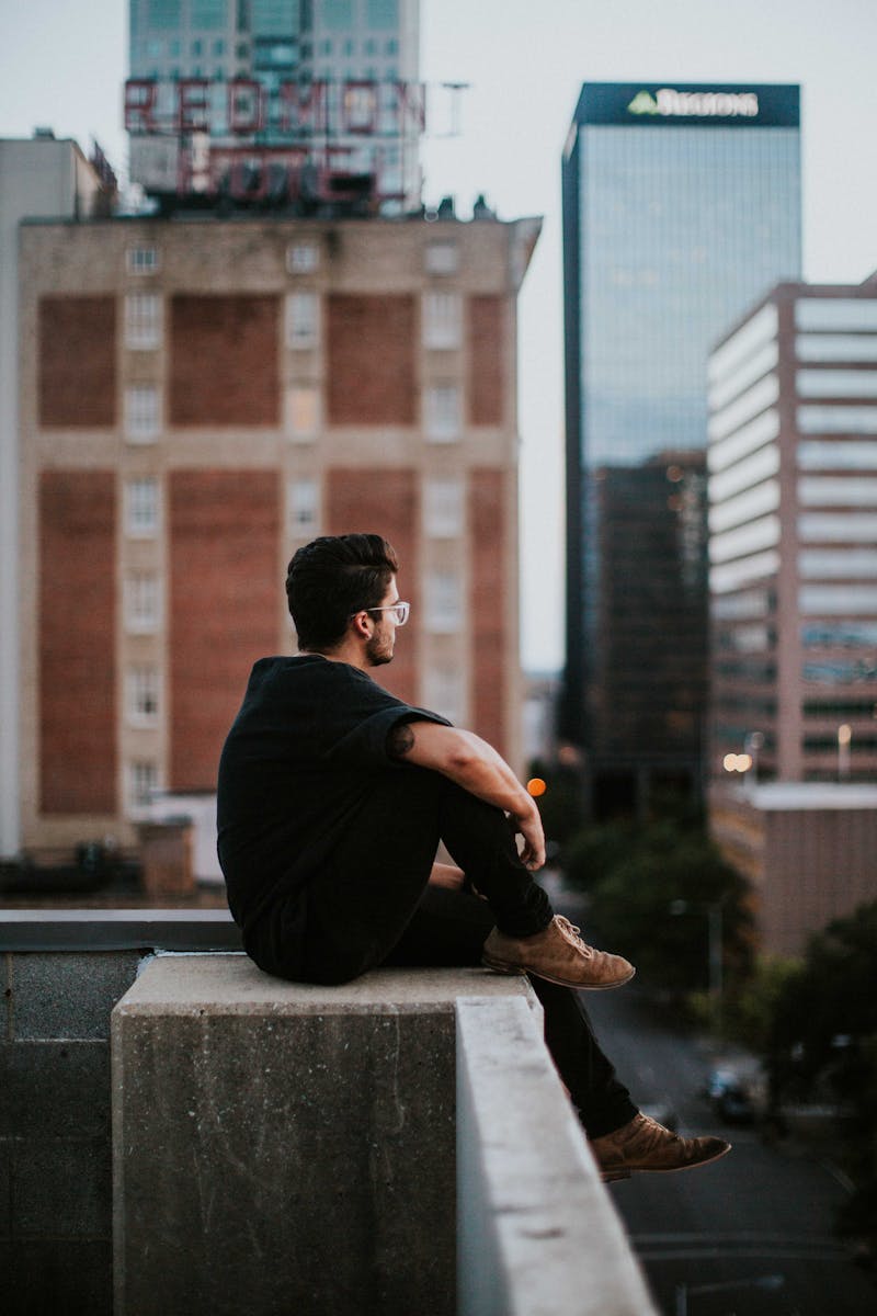 Guy looking out over roof tops