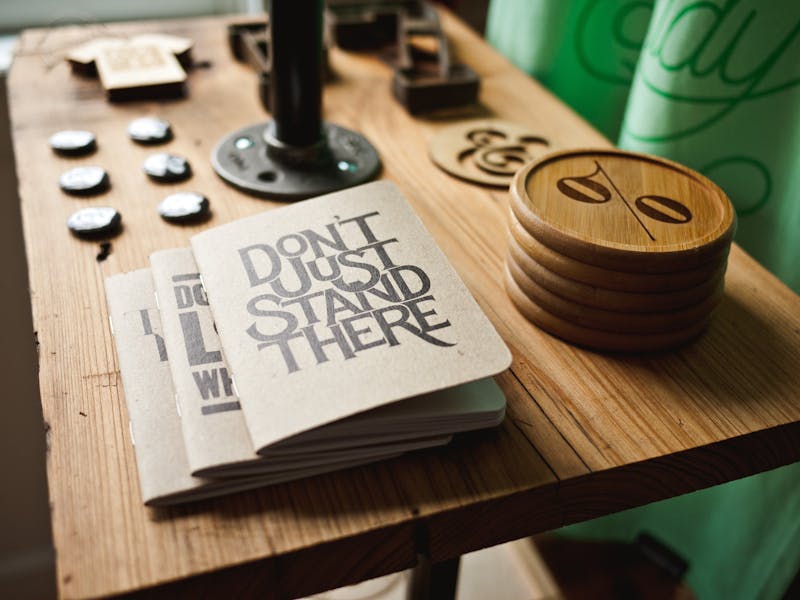 books on a table saying dont just stand there