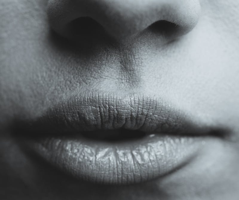 A woman's lips in black and white.