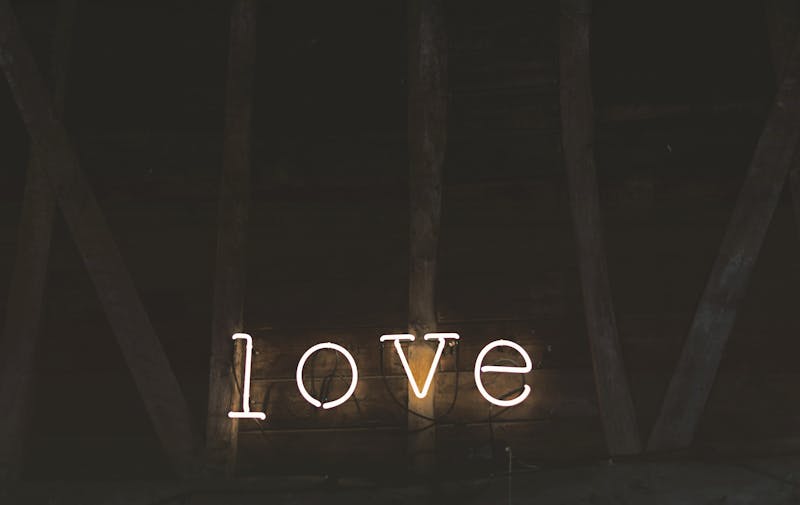 A neon sign that reads "love".