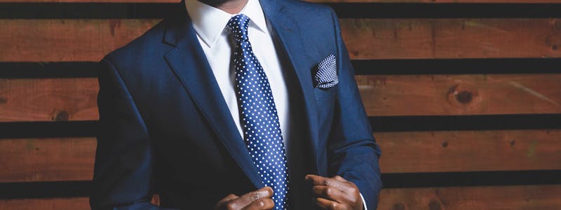 Man in a suit looking confident.