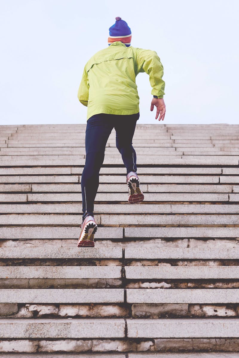 A person running up a flight of stairs.