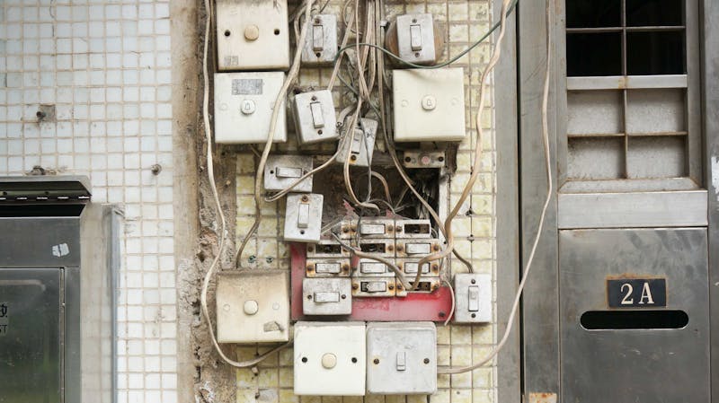 Many switches on a wall.