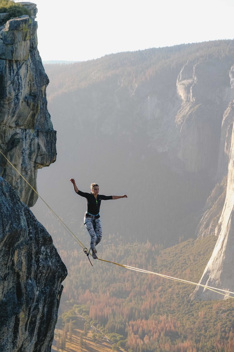 A very brave woman tightrope walking.