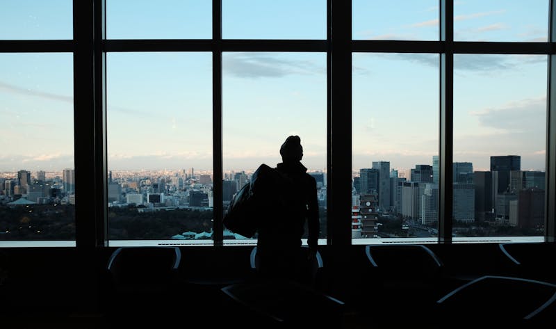 A view of a city with a man in the foreground.