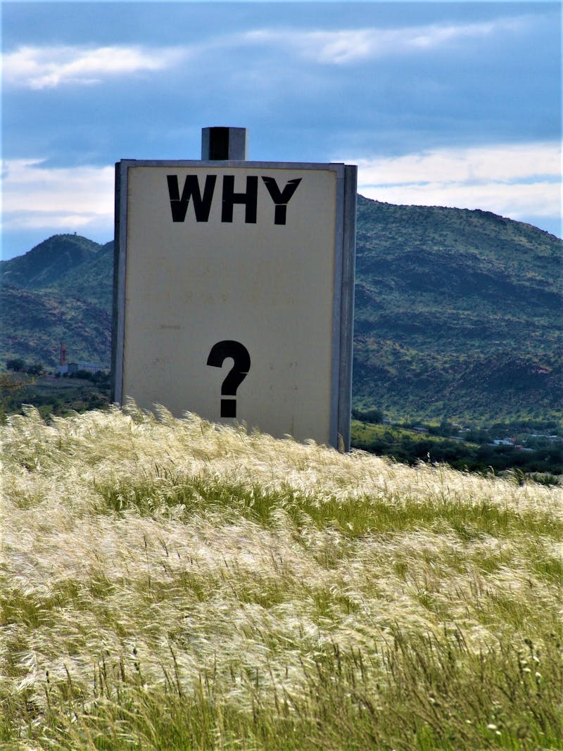 A sign with the words "WHY" on. Taken in Namibia.