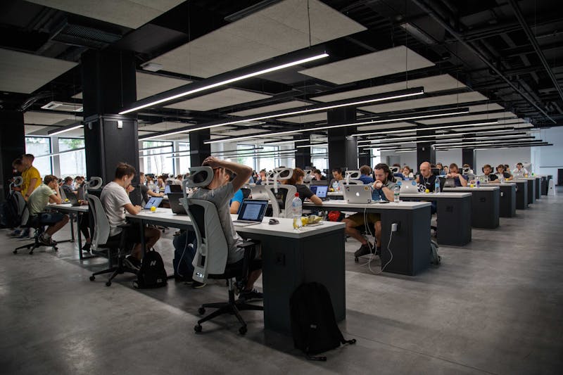 People sitting in a room working on their computers.