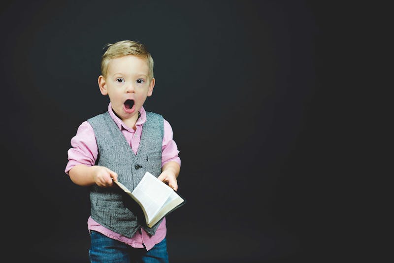 Young boy looking surprised.